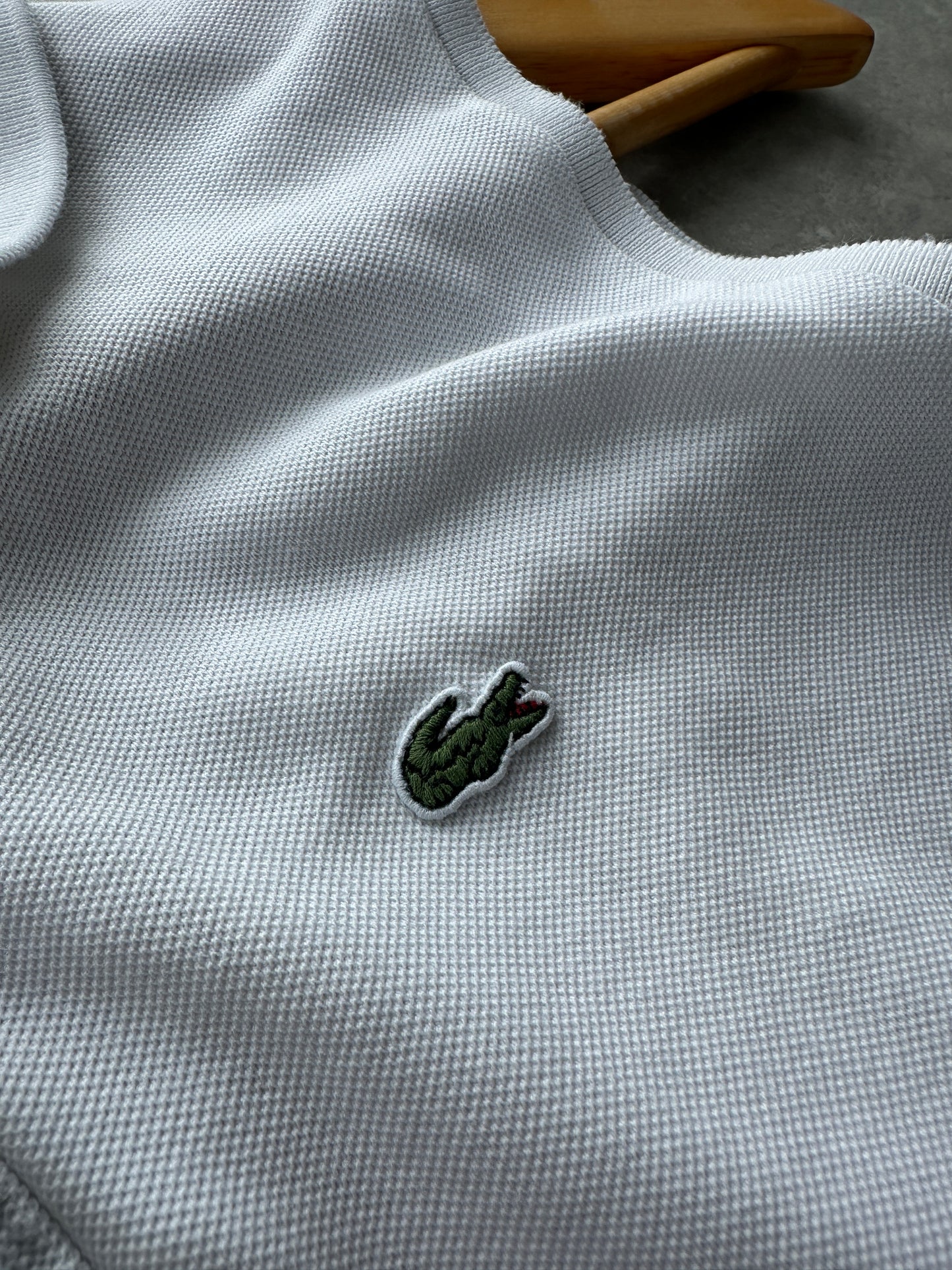 Lacoste ženska bijela polo majica bez rukava (44, 46)