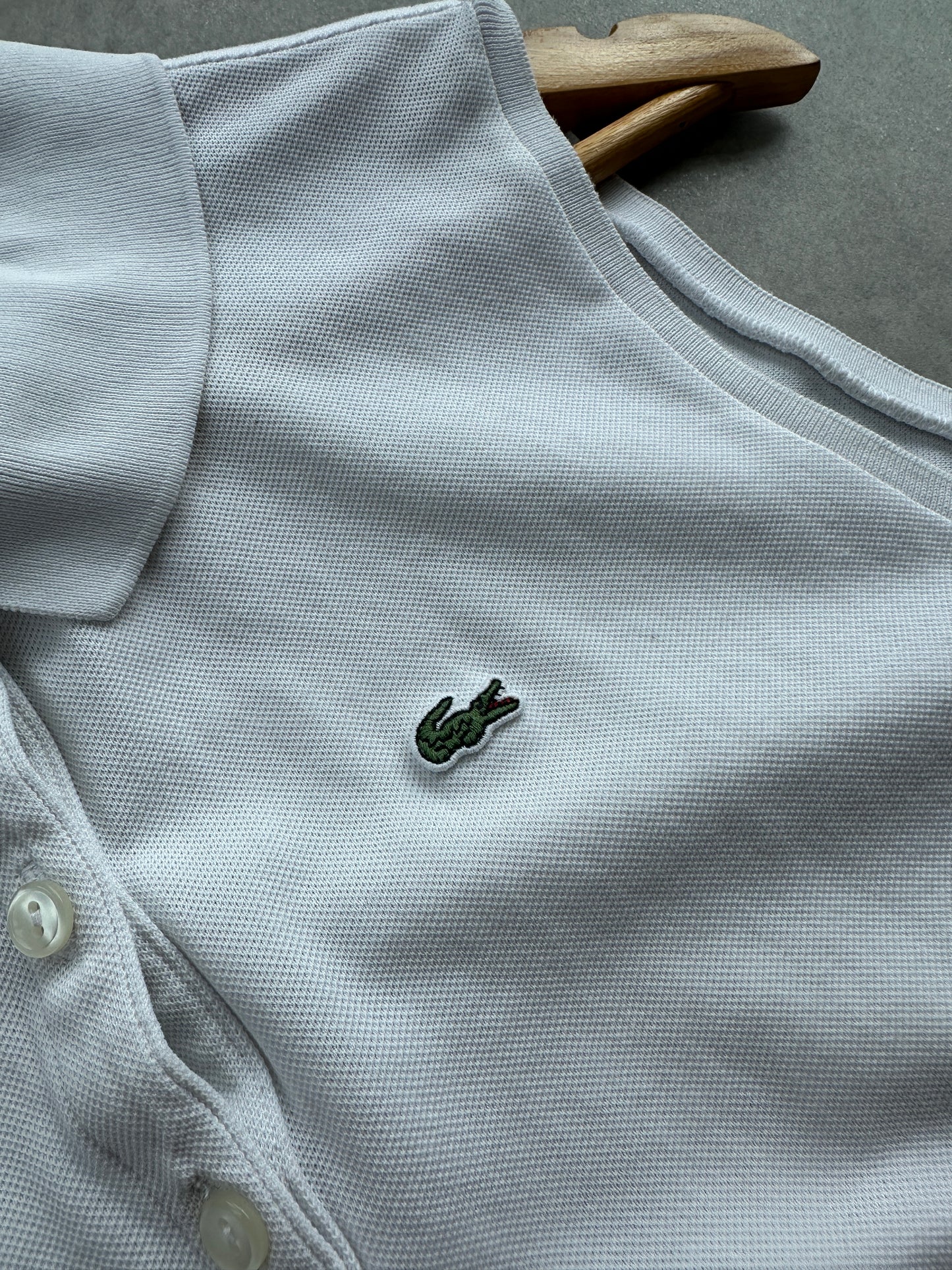 Lacoste ženska bijela polo majica bez rukava (44, 46)